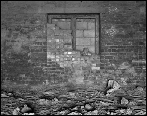 bricked-up window through arch